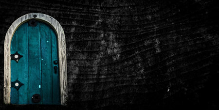 Fairytale fantasy house in tree trunk in forest. Small doors in the tree. Dwarf house.の写真素材