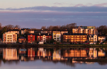 Houses on a street in Galway, Ireland are reflected on the surface.の写真素材