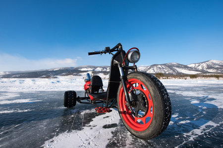 Motorcycle on the ice of the frozen lake Baikal.