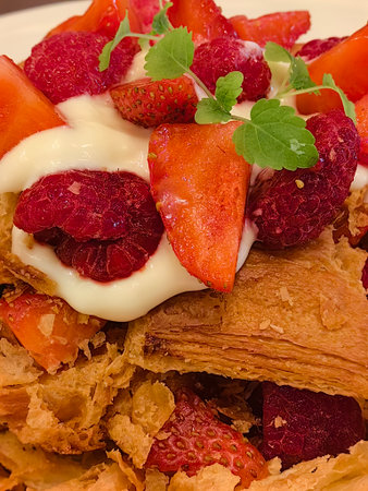 Breakfast with cornflakes and strawberries, close-up.の写真素材