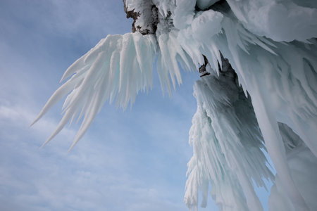 Icicles on the form of wings Lake Baikal in winter, Siberia, Russiaの写真素材
