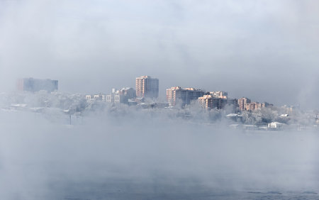 cityscape of the city in the fog on a cold winter dayの写真素材