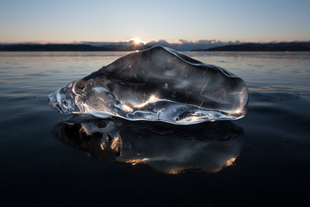 piece of ice on the surface of Lake Baikal at sunset, Siberia, Russia