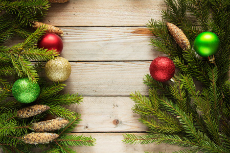 Colored Christmas balls with fir branchesの写真素材