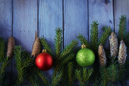 Colored Christmas balls with fir branchesの写真素材