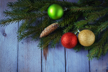 Colored Christmas balls with fir branchesの写真素材