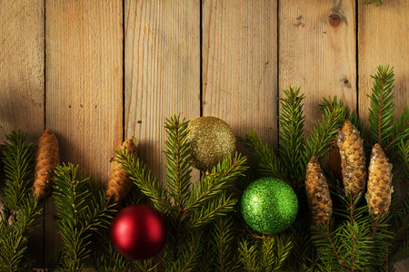 Colored Christmas balls with fir branchesの写真素材