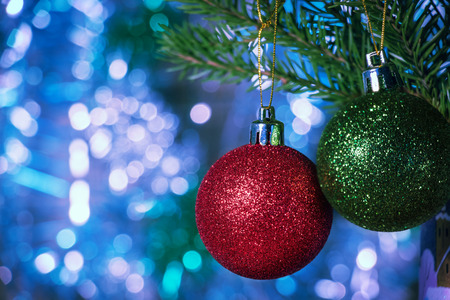 Colored Christmas balls with fir branchesの写真素材