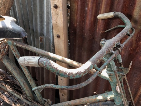 Vintage bicicle handlebars with rustの素材