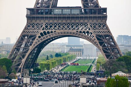 Crowd gathered at the base of the Eiffel tower,the most iconic attraction in Paris, France on April,11 2017.のeditorial素材