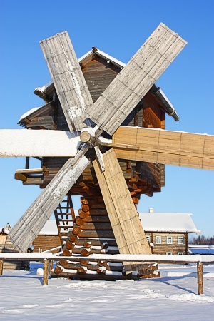 ancient wooden windmill in the winterの写真素材