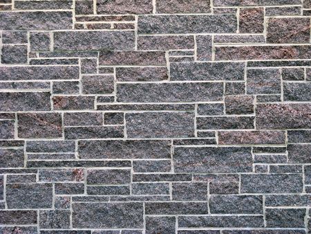 pink and lavender granite stone wall 