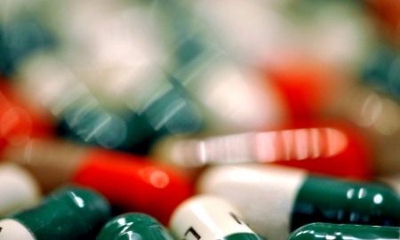 Closeup of brightly colored medicine capsules; shallow DOF.