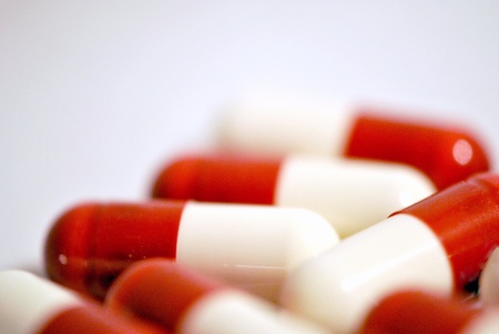 Red and white medicine capsules