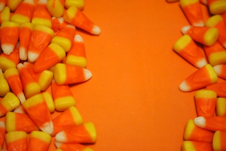 candy corn borders on an orange backgroundの写真素材