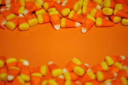 candy corn borders on an orange background