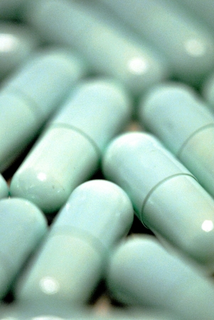 Green medicine capsules closeup