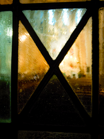 Looking through stained glass door into the churchの写真素材