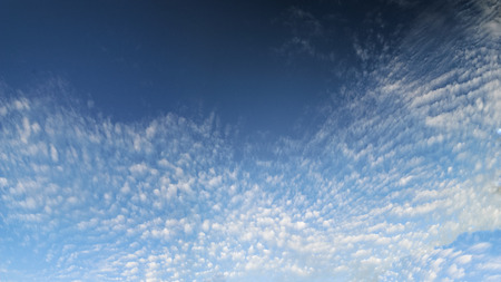 Thin clouds in a bright blue sky