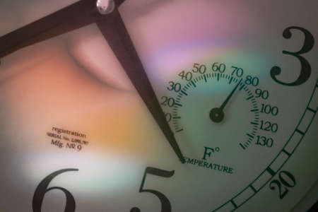 vintage wall clock in light from stained glass windowの写真素材