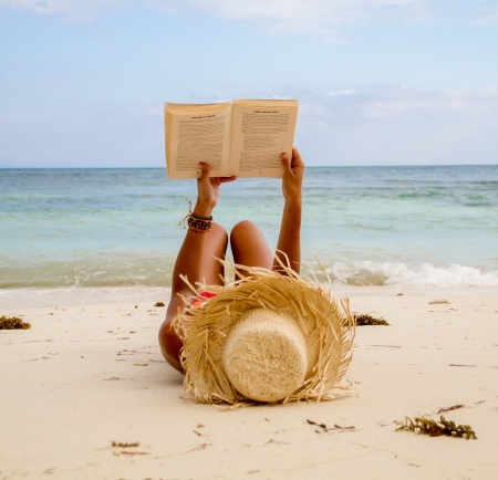 reading at the beachの写真素材