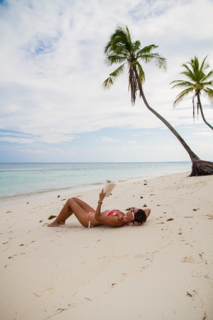 reading at the beachの写真素材