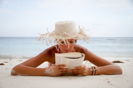 reading at the beachの写真素材