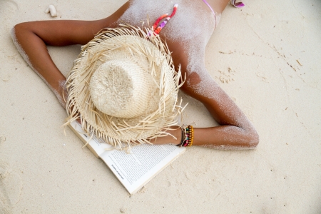 reading at the beachの写真素材