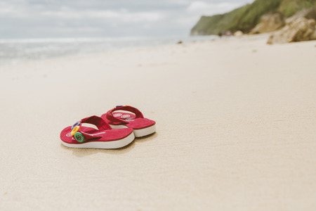 Flip flops on beach, Bali, Indonesiaの写真素材