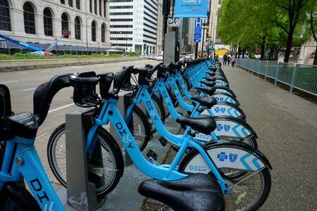 Chicago, IL, USA - May 17, 2019 - Divvy bycicle station on Michigan Avenue without visible traffic