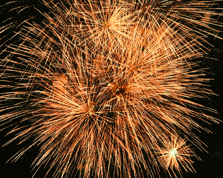 Firework exploding in the sky with dazzling displayの写真素材