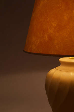 a lighted lamp on a gray background
