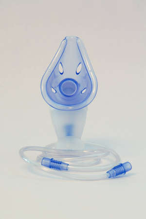 inhaler for bronchitis, blue mask and tubingの写真素材