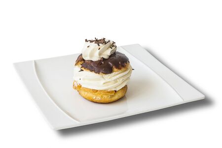 Cake with cream and chocolate isolated on white background