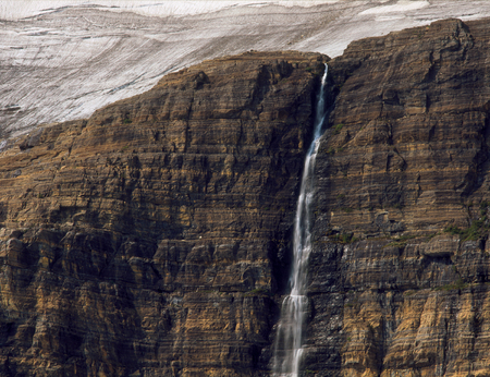 Waterfall and Salamander Glacier from Upper Grinnell Lake, Glacier National Park, Montanaの写真素材