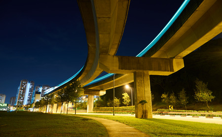 light trail highway and bridge at nightの写真素材