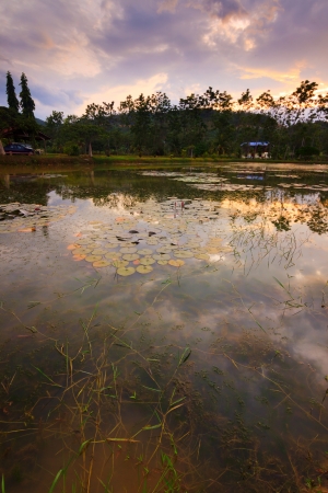 Reflection of dramatic sky on a lakeの写真素材