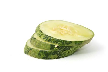 Sliced cucumber over white backgroundの写真素材