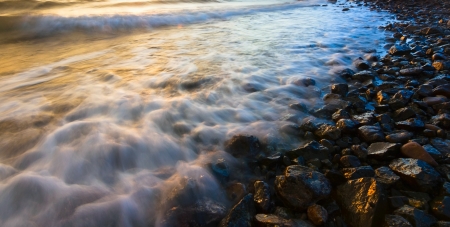 Dramatic and colorful flowing wavesの写真素材