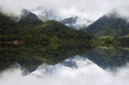 Reflection of misty hills at Sabah, Borneo, Malaysiaの写真素材