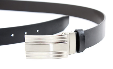 Black leather belt isolated on whiteの写真素材