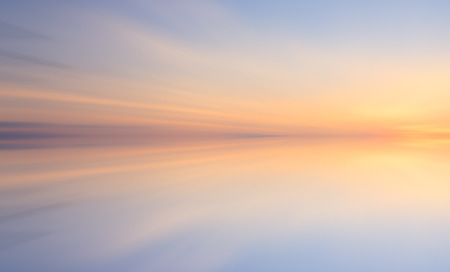 Reflection of colorful sunset with long exposure effect, zoom blurredの写真素材