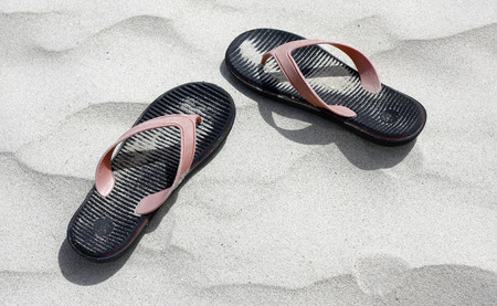Flip flop on white sandの写真素材