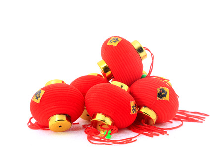 Group of small red Chinese lanterns for decoration over white background.  The chinese word means fortune.の写真素材