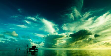 Dramatic sunrise sky and clouds over coastline in Kudat, Sabah, Malaysiaの写真素材