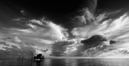 Dramatic sunrise sky and clouds over coastline in Kudat, Sabah, Malaysiaの写真素材