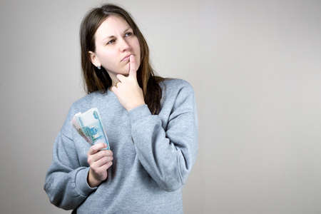 A close up person with money in hands