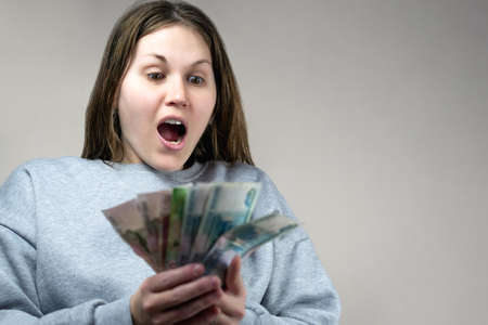 A close up person with money in handsの写真素材