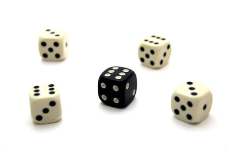 Five dice, one black, four white, full houseの写真素材