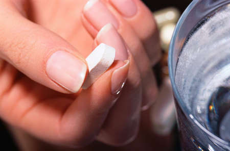 A person about to take medicine.